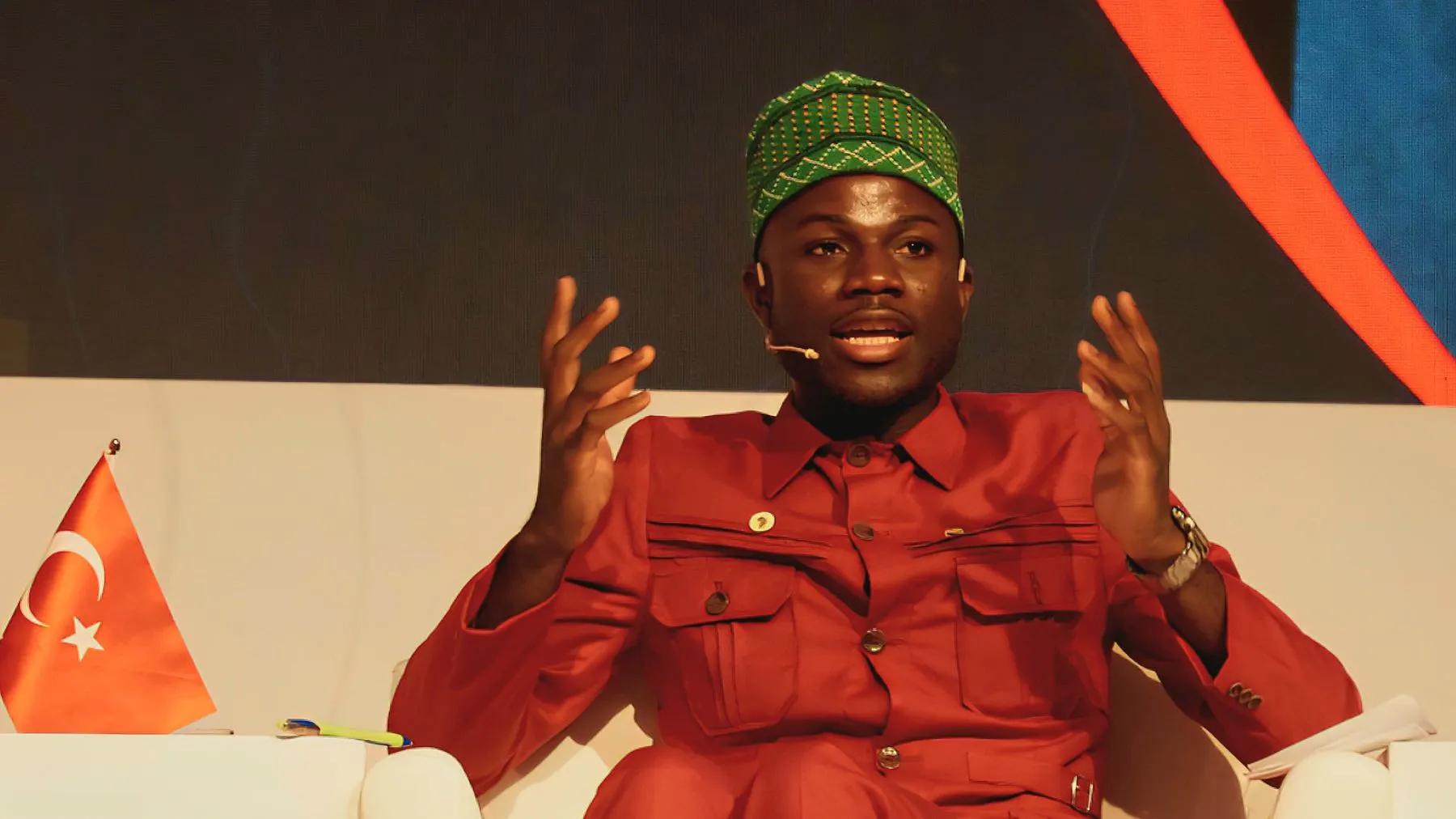 Faroukou Mintoiba speaking on a conference panel